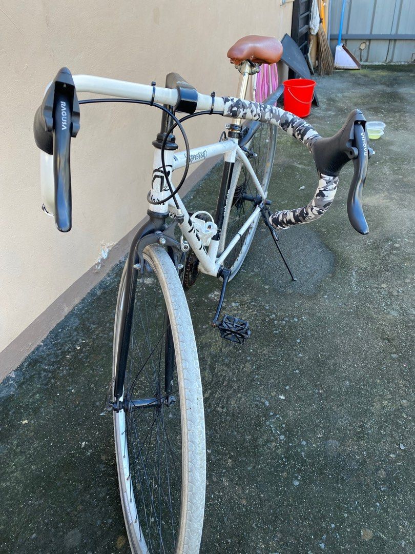 Japanese Road Bike (Category: Bicycles) located in Manila. Submitted by simple_ideas (Listing ID 1413301582, Image 2). Description: - White Nexfile Junior road bike, converted to single speed pero nandun pa rin component. Hindi na inayos at nalinis may bagong roadbike na. As is were is condition. - Drop handlebars - Brown saddle - Rear fender - Black components (fork, crankset, pedals) - 7-speed cassette - Rim brakes - White tires - Includes wate