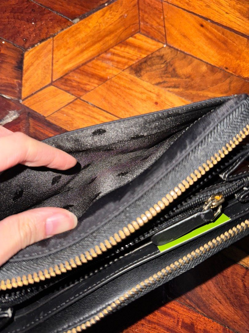 Kate Spade Long Black Nylon Wallet (AUTHENTIC) (Category: Luxury Bags & Wallets) located in Quezon City. Submitted by jellyaceeyoo (Listing ID 1413403790, Image 3). Description: •Price is slightly negotiable •Minor flaw only on the zipper • Green dot on the cloth is just a reflection from camera flash •Will not send more pictures in chat as details can be seen in the listing •Payment: GCash •Delivery: Same-day delivery/ Courier.