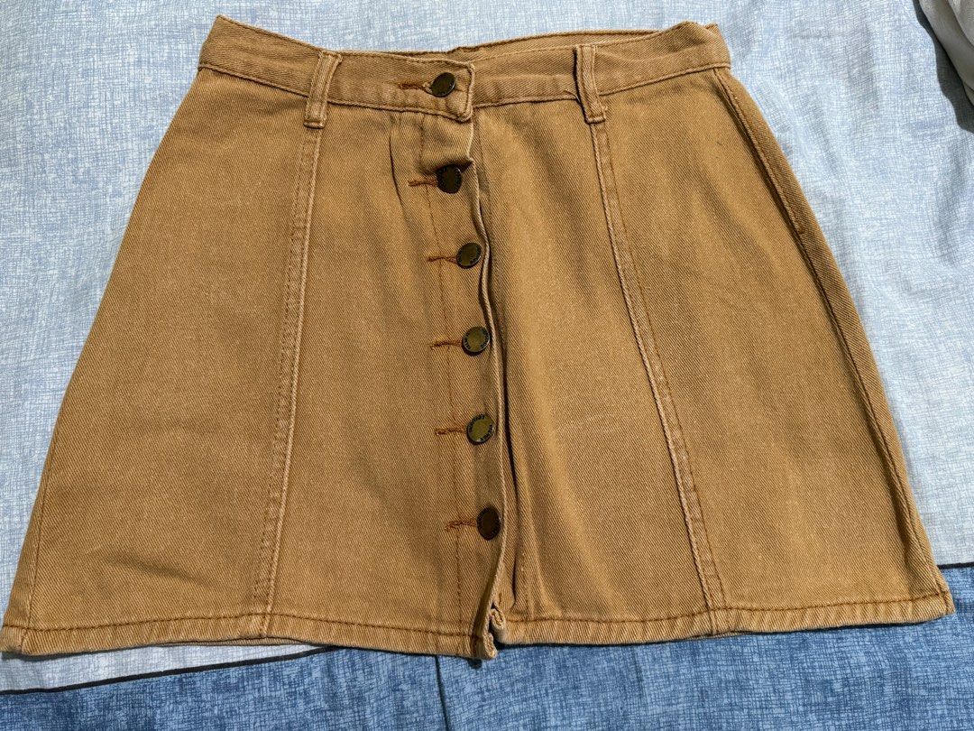 Khaki Denim Button-Up Skirt (Category: Skirts) located in Manila. Submitted by itswayne (Listing ID 1413316191, Image 1). Description: - Brown / Khaki denim skirt - Button-up front - Classic A-line silhouette - rfs: declutter.