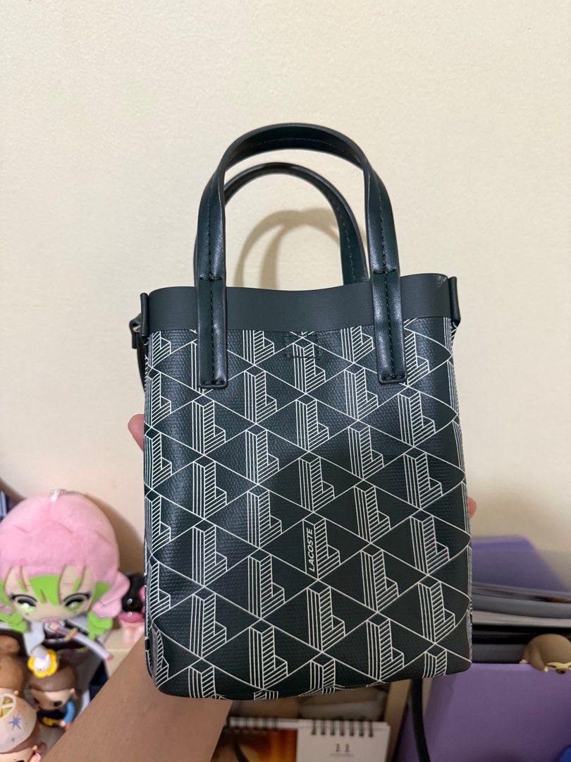 Lacoste Zely Coated Canvas Monogram Mini Tote - Green (Category: Tote Bags) located in Pasig City. Submitted by mschesca (Listing ID 1413405592, Image 2). Description: -Unique geometric pattern - Top handle with shoulder strap - Rectangular shape with flat base - Lined interior - Small size, ideal for essentials.