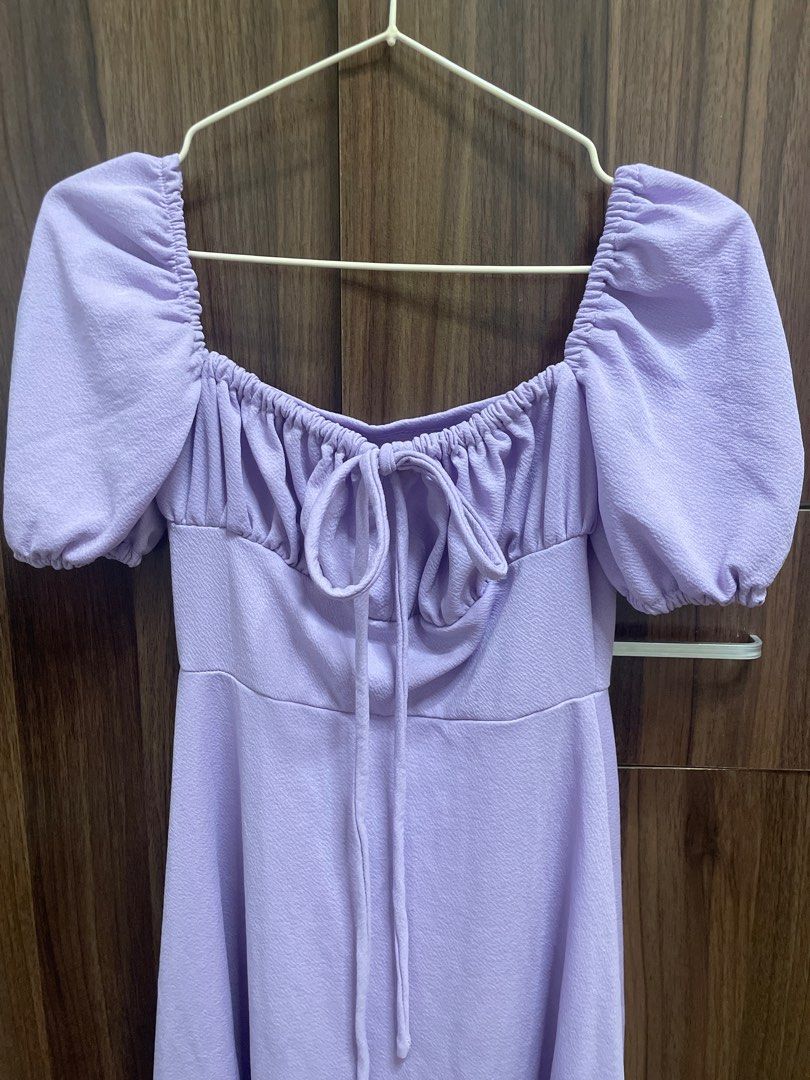 Lavender Puff Sleeve Dress (Category: Dresses) located in Manila. Submitted by jasmoontea (Listing ID 1413294203, Image 2). Description: - Lavender dress - Puff sleeves - Square neckline with tie detail - Fitted bodice - Flowing skirt - Soft, lightweight fabric - Suitable for casual and semi-formal events.
