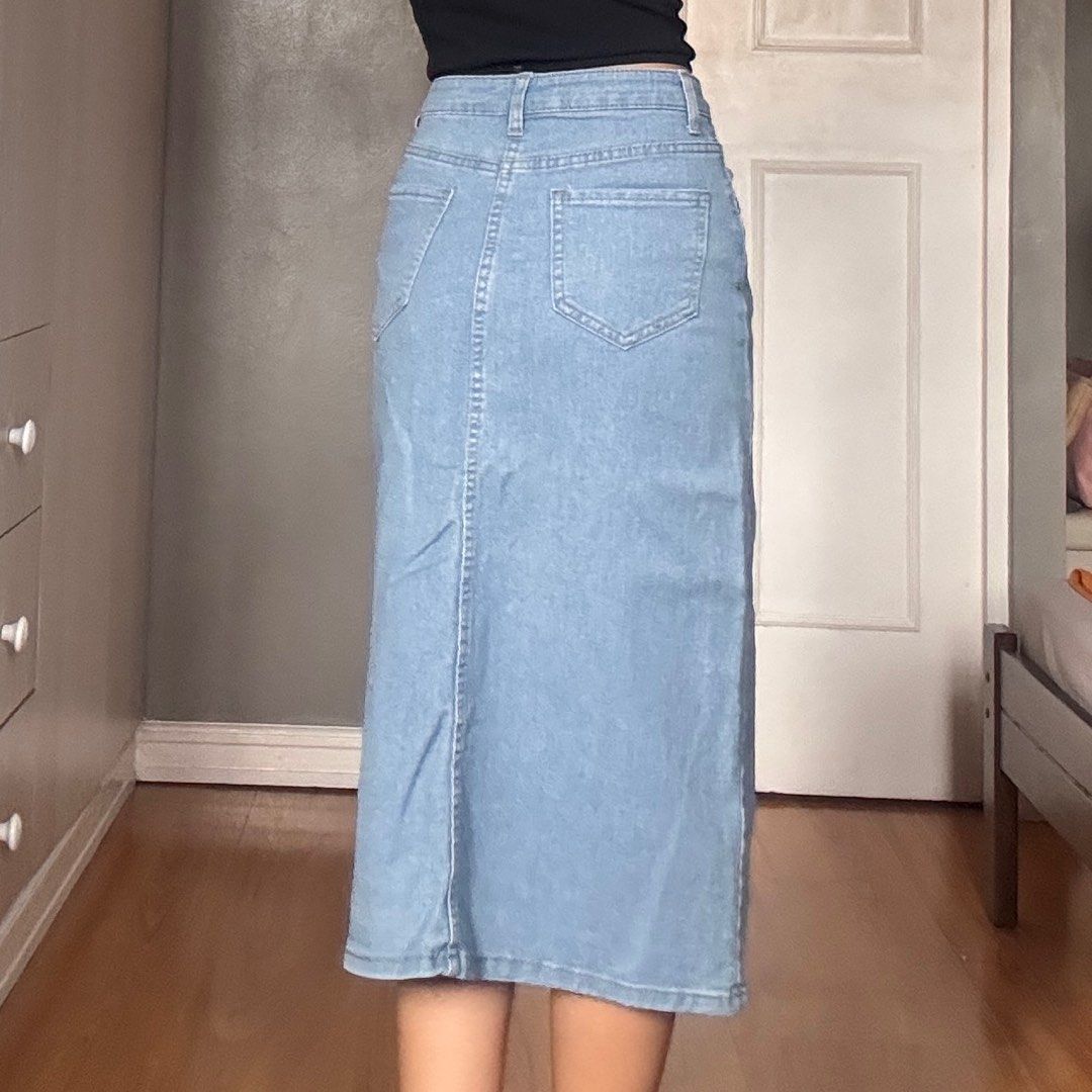 Light Wash Denim Midi Skirt (Category: Skirts) located in Quezon City. Submitted by kaeshops (Listing ID 1413364861, Image 3). Description: Decluttering my preloved clothes! PM me for more photos 🩷 items are negotiable if buying multiple items! Can do meet-ups or ship from Diliman, QC or Sampaloc, Manila - Light wash denim midi skirt - Front slit detail - Classic five-pocket design - Stretchy and garterized - Breathable material, perfect for eve