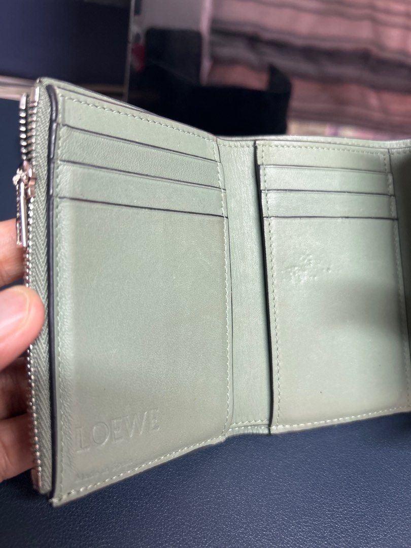 LOEWE Anagram Leather Trifold Wallet (Category: Luxury Bags & Wallets) located in Pasig City. Submitted by closet4hope (Listing ID 1413234867, Image 2). Description: Authentic LOEWE Anagram Trifold wallet in soft grained calfskin leather - Loewe logos in front of wallet and when you open - with zippered compartment for coins or other items - multiple card slots - size when open and laid flat (allow for slight discrepancies) width = 22 cm height =
