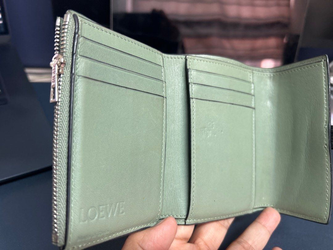 LOEWE Anagram Leather Trifold Wallet (Category: Luxury Bags & Wallets) located in Pasig City. Submitted by closet4hope (Listing ID 1413234867, Image 3). Description: Authentic LOEWE Anagram Trifold wallet in soft grained calfskin leather - Loewe logos in front of wallet and when you open - with zippered compartment for coins or other items - multiple card slots - size when open and laid flat (allow for slight discrepancies) width = 22 cm height =