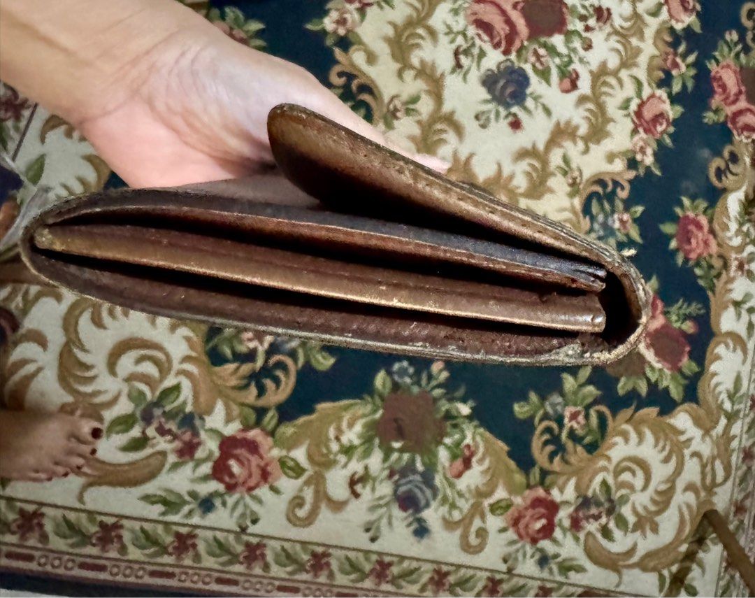 Louis Vuitton Monogram Sarah Wallet (Category: Luxury Bags & Wallets) located in Muntinlupa City. Submitted by cher_ami (Listing ID 1413297114, Image 2). Description: - Authentic Louis Vuitton Monogram Sarah wallet - Features the iconic LV monogram design - Cashcompartments - Secure snap closure - Includes a zippered pocket - Exterior and interior show some wear and tear -No date code. It’s vintage -No cracks -Zipper is smoothly working -No inclu