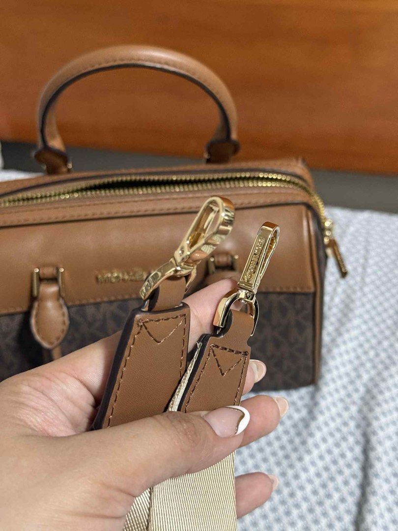 Michael Kors XS duffle bag (Category: Luxury Bags & Wallets) located in Binangonan. Submitted by cocoeyber (Listing ID 1413396626, Image 2). Description: Selling my preloved bag, used only twice. Can pass as brandnew. Rfs: i need a bigger bag for work .