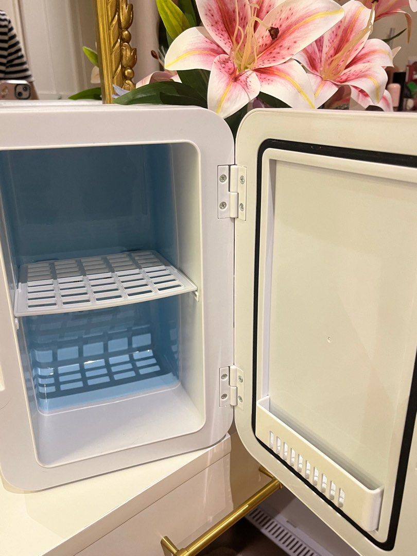 Mini Fridge (Skincare Ref/ Mini Cooler) (Category: Refrigerators and Freezers) located in Quezon City. Submitted by matchaprincess33 (Listing ID 1413417566, Image 3). Description: - Barely Used (1-2x), Got this on the 🍊 app. - Compact white mini fridge - Perfect for skincare or drinks - Features a small interior shelf - Easy access with door handle - USB powered.