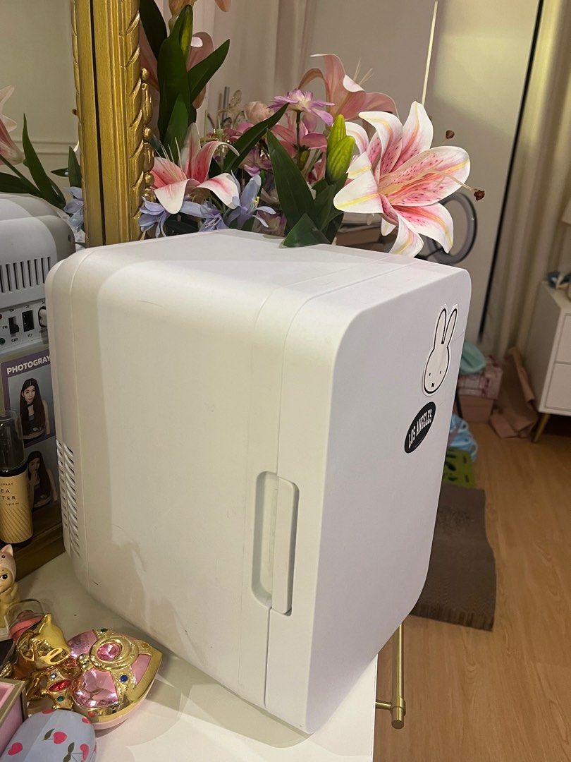 Mini Fridge (Skincare Ref/ Mini Cooler) (Category: Refrigerators and Freezers) located in Quezon City. Submitted by matchaprincess33 (Listing ID 1413417566, Image 2). Description: - Barely Used (1-2x), Got this on the 🍊 app. - Compact white mini fridge - Perfect for skincare or drinks - Features a small interior shelf - Easy access with door handle - USB powered.