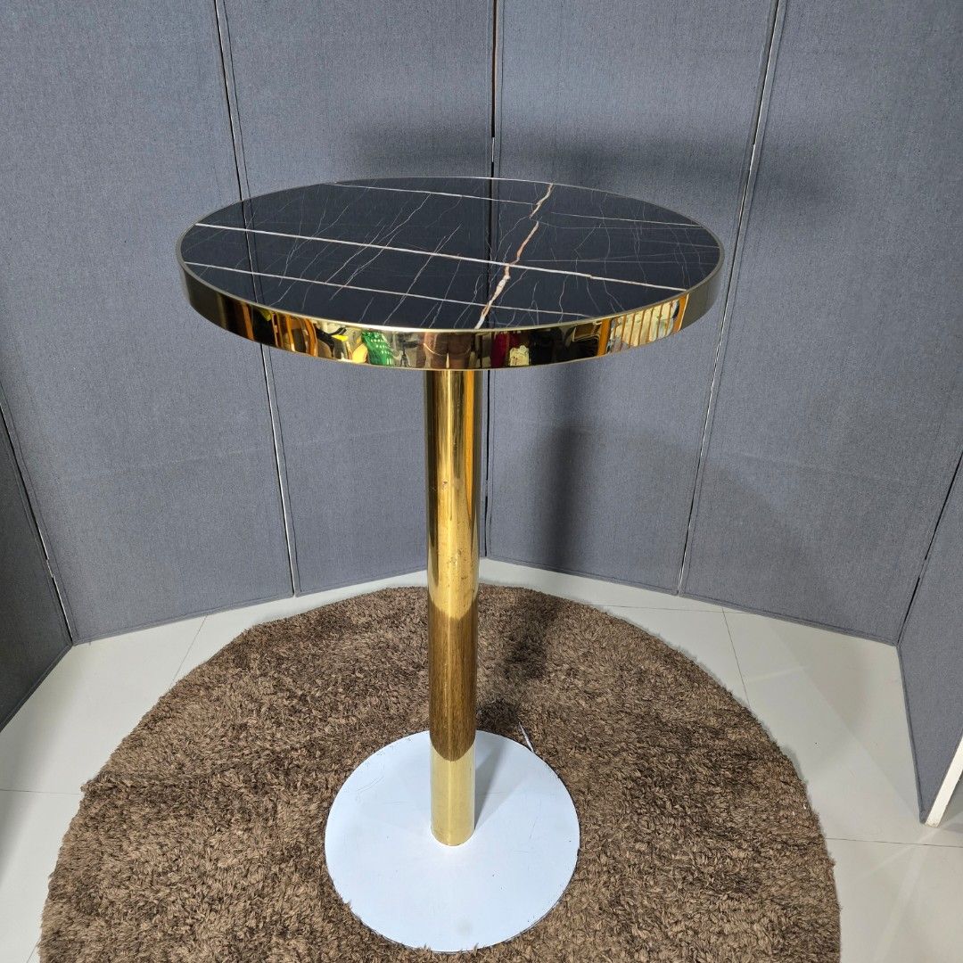 Modern Gold Accent Round Bar Table (Category: Tables & Sets) located in Pasig City. Submitted by millennialthrifter (Listing ID 1413236515, Image 1). Description: 🔥MODERN GOLD ACCENT ROUND BAR TABLE- ( 4900 PREV PRICE)❗️ Black marble-look stone top paired with a sleek gold pedestal base 🤍 Perfect as a side table, café table, or condo accent piece. ✅️ Elegant & modern design ✅️ Heavy and sturdy ✅️ Statement piece for any space ✅️ Easy to clean ✅