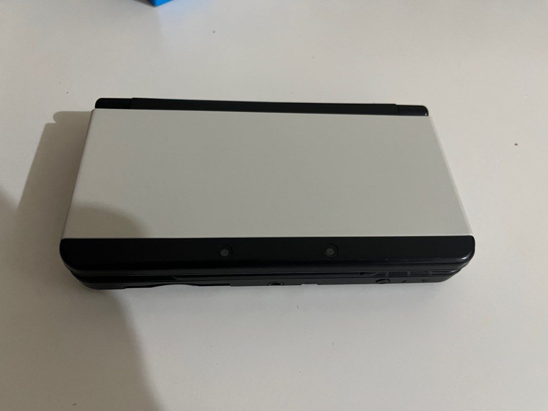New Nintendo 3ds Regular Black (Category: Nintendo) located in San Juan City. Submitted by paboopy (Listing ID 1413426378, Image 1). Description: - New Nintendo 3DS Regular Black. - Includes all buttons and controls. - Console is in working condition. - CFW With games Issues: - Camera not working - Has damage near the hinge but still works fine (See last picture) Inclusion: - New Nintendo 3ds Black - Charger - SD Card - Stylus.