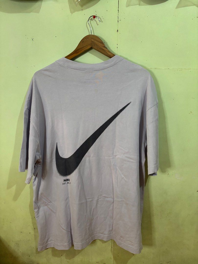 Nike Mid Swoosh shirt (Category: Tshirts & Polo Shirts ) located in Tayabas. Submitted by mandothriftss (Listing ID 1413244410, Image 3). Description: - Nike oversized t-shirt - Light purple color - Small Nike logo on chest - Large Nike swoosh on back - "NIKE JUST DO IT" tag - Made in China - Size: XL - Measurements: W23 L29.