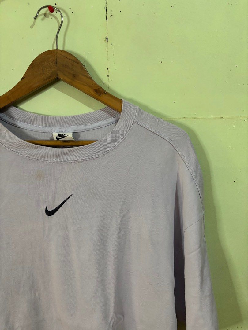 Nike Mid Swoosh shirt (Category: Tshirts & Polo Shirts ) located in Tayabas. Submitted by mandothriftss (Listing ID 1413244410, Image 2). Description: - Nike oversized t-shirt - Light purple color - Small Nike logo on chest - Large Nike swoosh on back - "NIKE JUST DO IT" tag - Made in China - Size: XL - Measurements: W23 L29.