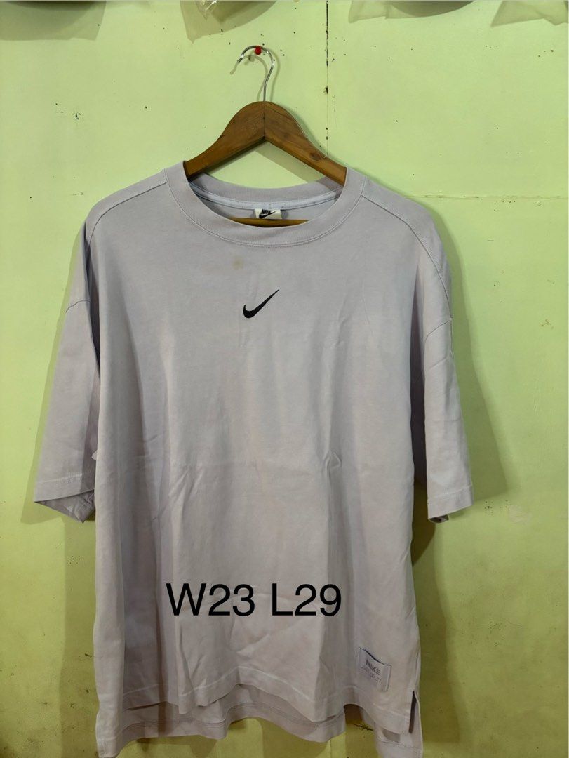 Nike Mid Swoosh shirt (Category: Tshirts & Polo Shirts ) located in Tayabas. Submitted by mandothriftss (Listing ID 1413244410, Image 1). Description: - Nike oversized t-shirt - Light purple color - Small Nike logo on chest - Large Nike swoosh on back - "NIKE JUST DO IT" tag - Made in China - Size: XL - Measurements: W23 L29.