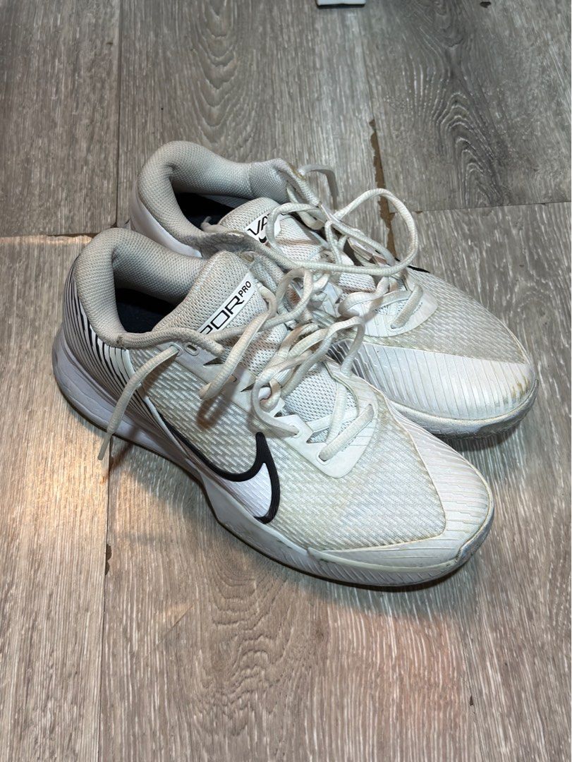Nike Vapor Pro White Sneakers (Category: Sneakers) located in Bacolod City. Submitted by paolooops13 (Listing ID 1413426398, Image 2). Description: - Nike Vapor Pro sneakers - White upper with black accents - Black Nike swoosh - White laces - Textured sole - US size 8 - Signs of wear on soles and uppers.