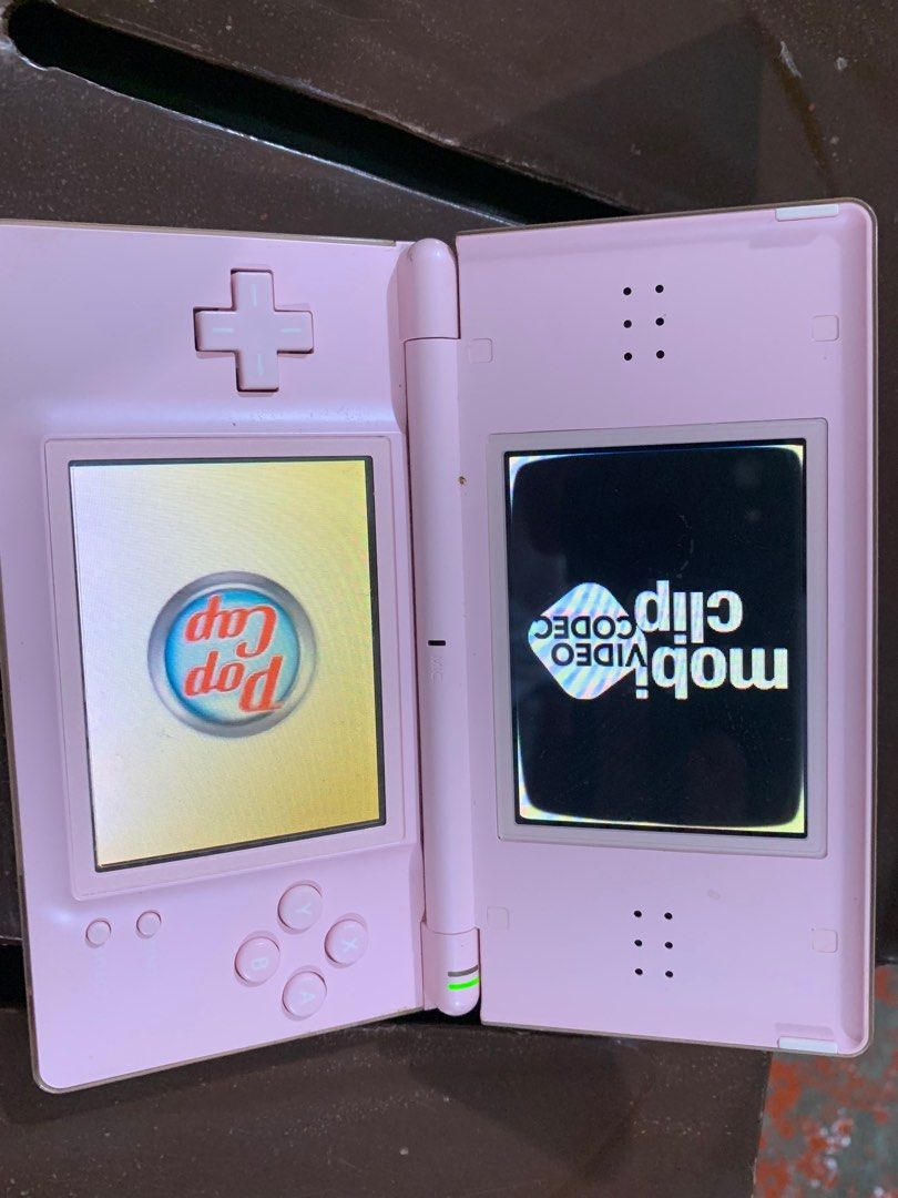 Nintendo DS Lite Pink Console (Category: Nintendo) located in Manila. Submitted by miah_collectiblesurplus (Listing ID 1413378364, Image 2). Description: 1,500 pesos Location: Valenzuela TESTED WORKING selling as is from Japan item Wala charger and wala game na kasama .