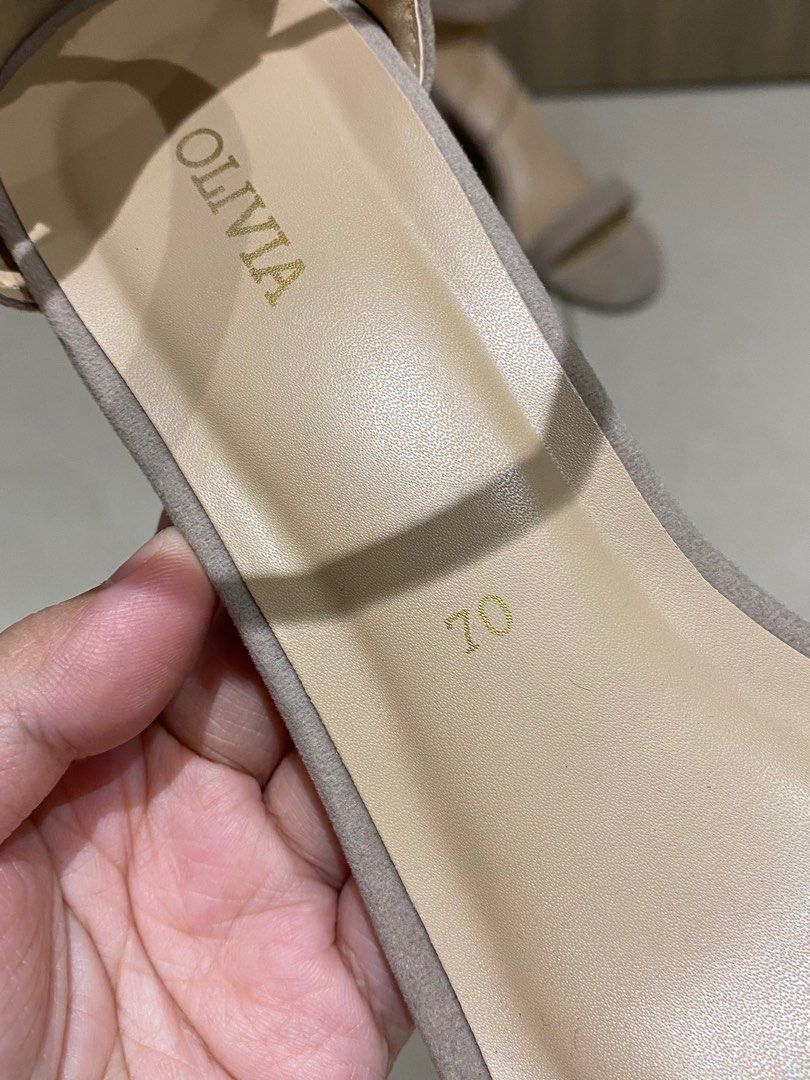 Olivia Block Heel Sandals (Category: Flats & Sandals) located in Mandaluyong City. Submitted by raspberryjamzzz (Listing ID 1413328975, Image 2). Description: - Olivia block heel sandals - Ankle strap for secure wear - Neutral color - Size 70 - Versatile for various outfits - Adds a touch of sophistication.