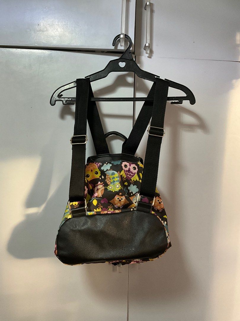 Owl Print Mini Backpack (Category: Backpacks) located in San Pedro. Submitted by dottable (Listing ID 1413433872, Image 2). Description: - NOTE: Some small stains observed on flap interior but barely noticeable! - 12x11x5 in (HxLxW) - Mini backpack with an adorable owl print - Adjustable shoulder straps and top handle - Main compartment with drawstring closure - Secure flap with magnetic snap - Front zippered pockets (one zipper and one with magn