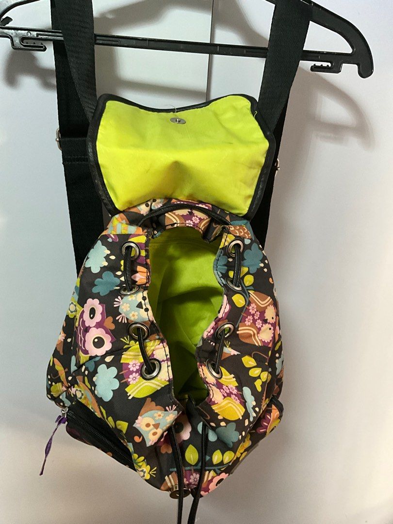 Owl Print Mini Backpack (Category: Backpacks) located in San Pedro. Submitted by dottable (Listing ID 1413433872, Image 3). Description: - NOTE: Some small stains observed on flap interior but barely noticeable! - 12x11x5 in (HxLxW) - Mini backpack with an adorable owl print - Adjustable shoulder straps and top handle - Main compartment with drawstring closure - Secure flap with magnetic snap - Front zippered pockets (one zipper and one with magn