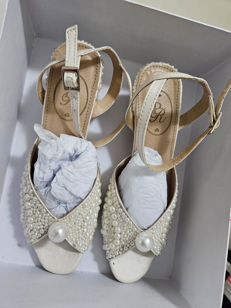 Pearl Embellished Sandals (Category: Flats & Sandals) located in Quezon City. Submitted by rosannero70769 (Listing ID 1413236594, Image 1). Description: - Pearl-embellished sandals - Secure buckle closure - Used once - Cushioned footbed for comfort - Ideal for special events or adding glamour.