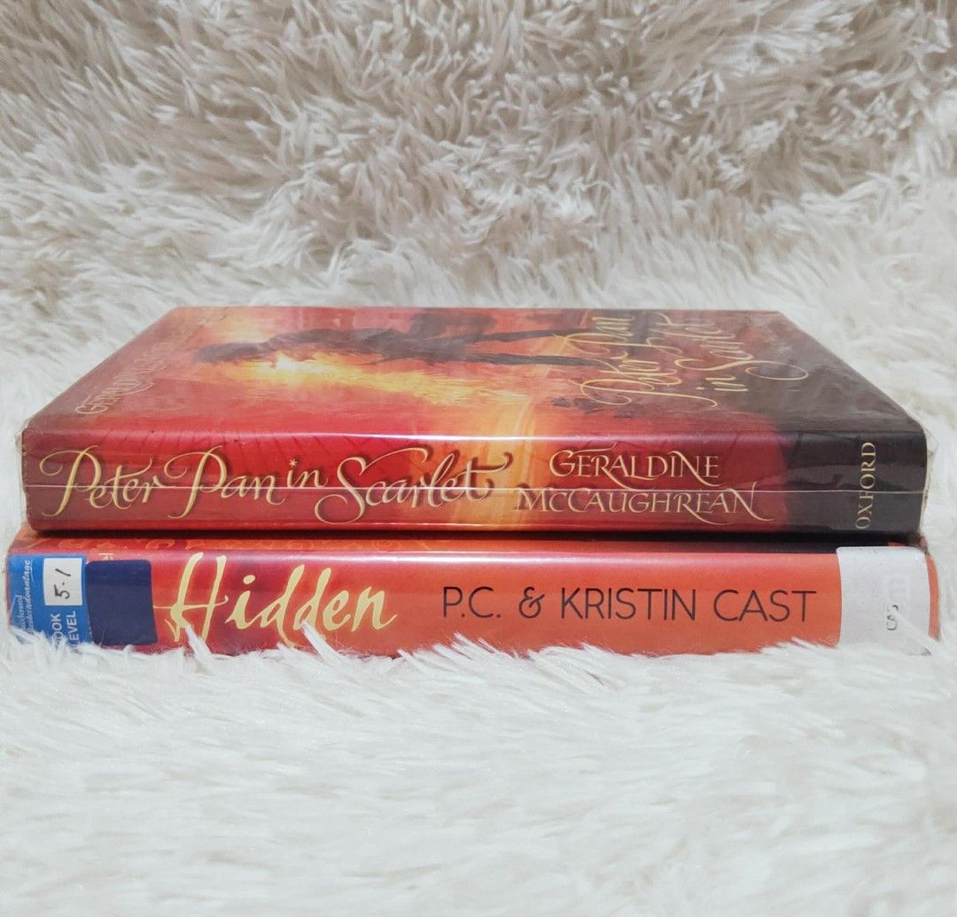 Peter Pan in Scarlet & Hidden Books (Category: Storybooks) located in Caloocan City. Submitted by andi289 (Listing ID 1413350211, Image 1). Description: - 'Peter Pan in Scarlet' by Geraldine McCaughrean - 'Hidden' by P.C. & Kristin Cast available. -All Authentic. -Minimal Creases. -Tan edges. -Can be bought in per piece or bundle. - Protected by plastic wrap. .