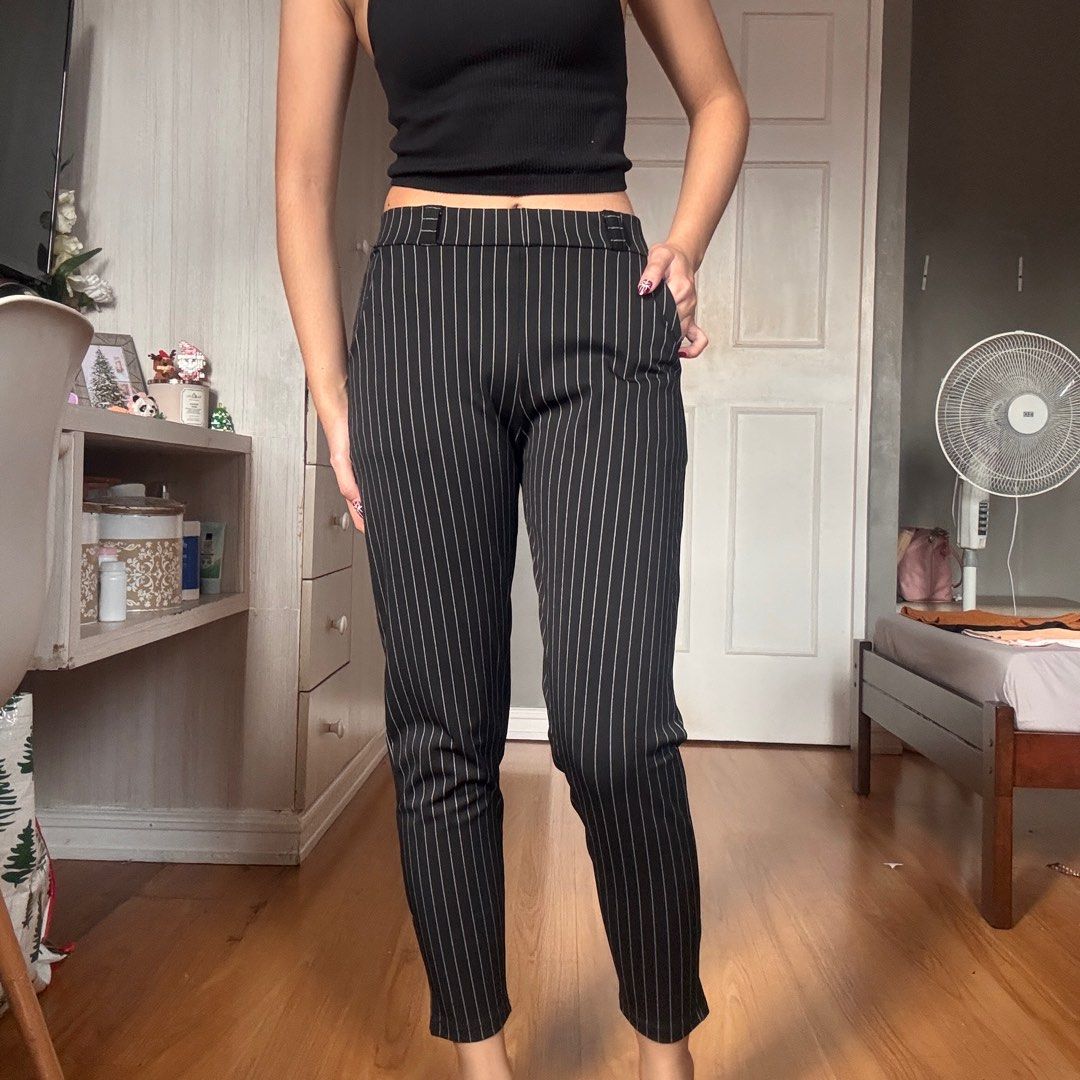 Pinstripe Trousers (Category: Trousers) located in Quezon City. Submitted by kaeshops (Listing ID 1413364869, Image 3). Description: Decluttering my preloved clothes! PM me for more photos 🩷 items are negotiable if buying multiple items! Can do meet-ups or ship from Diliman, QC or Sampaloc, Manila - Black pinstripe trousers - Slim fit, straight leg - Features pockets - Stretchy and garterized - Perfect for casual and semi-formal events.
