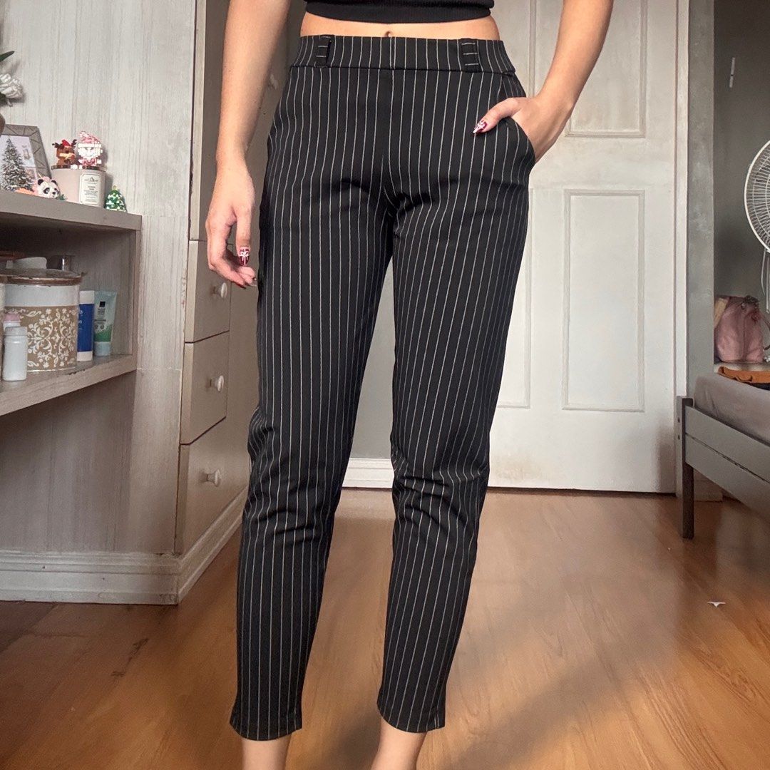 Pinstripe Trousers (Category: Trousers) located in Quezon City. Submitted by kaeshops (Listing ID 1413364869, Image 1). Description: Decluttering my preloved clothes! PM me for more photos 🩷 items are negotiable if buying multiple items! Can do meet-ups or ship from Diliman, QC or Sampaloc, Manila - Black pinstripe trousers - Slim fit, straight leg - Features pockets - Stretchy and garterized - Perfect for casual and semi-formal events.