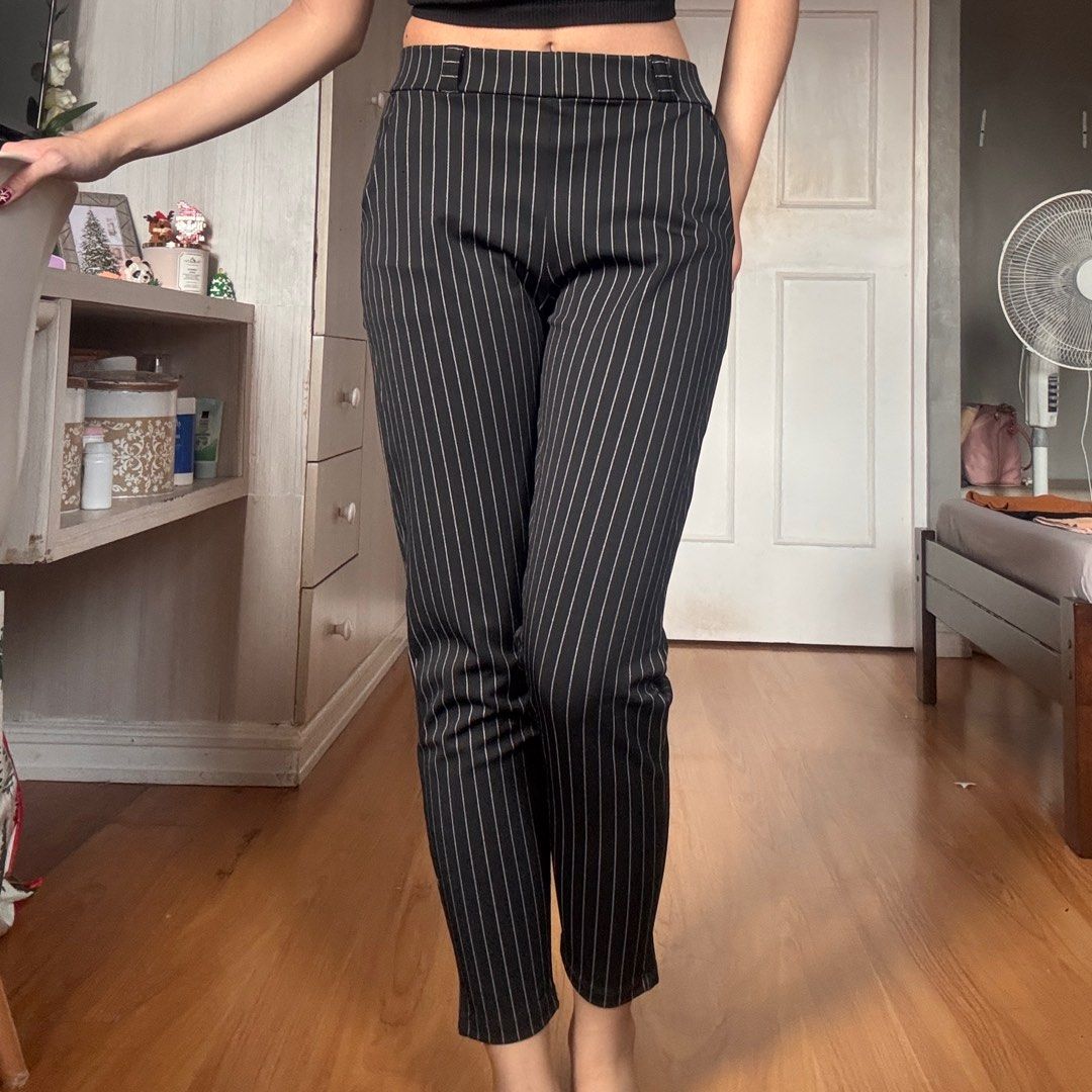 Pinstripe Trousers (Category: Trousers) located in Quezon City. Submitted by kaeshops (Listing ID 1413364869, Image 2). Description: Decluttering my preloved clothes! PM me for more photos 🩷 items are negotiable if buying multiple items! Can do meet-ups or ship from Diliman, QC or Sampaloc, Manila - Black pinstripe trousers - Slim fit, straight leg - Features pockets - Stretchy and garterized - Perfect for casual and semi-formal events.