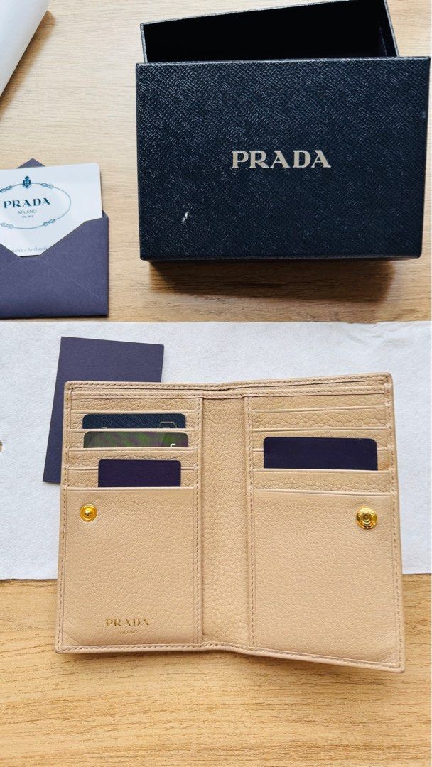 Prada Nude Bifold Wallet Cardholder (Category: Luxury Bags & Wallets) located in Pasig City. Submitted by decltter01 (Listing ID 1413318035, Image 2). Description: - Prada bifold wallet / card holder - in nude color - Made from Vitello Grain leather - Includes all original inclusions like box, authenticity card, cloth wrap. (credit cards for sample only!! Obviously not included haha) - lots of card slots -- especially in this cashless world! - Ca