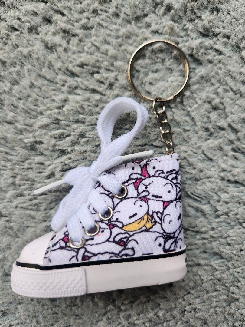 Shiro Crayon Shin Chan Sneaker Key Chain (Category: Everything Else Others) located in Caloocan City. Submitted by banshee8818 (Listing ID 1413230291, Image 2). Description: - Adorable cartoon sneaker keychain - White laces and gold-colored key ring - Black sole with textured pattern - Approximately 3 inches in length .