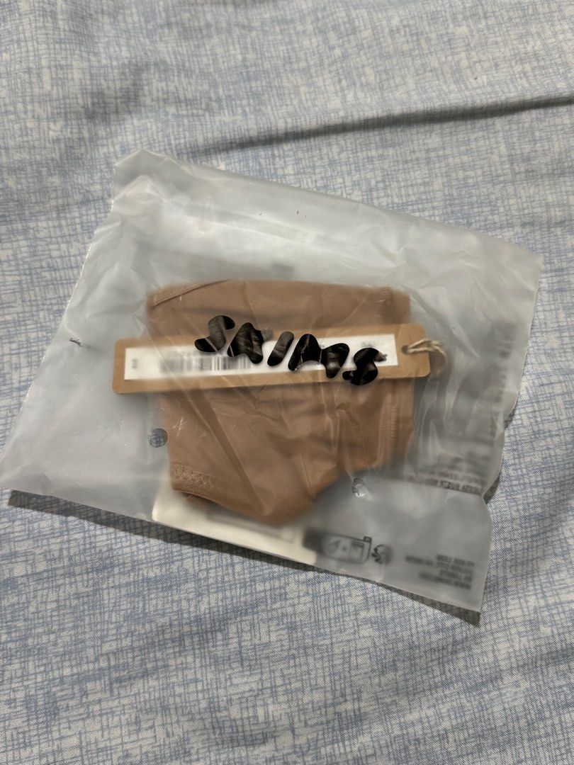 SKIMS Fits Everybody T-String Thong (Category: Undergarments & Loungewear) located in Manila. Submitted by itswayne (Listing ID 1413262866, Image 3). Description: - brand new !!! - Color: Sienna - Size: XS - Condition: New, sealed, with tag - Quantity: Multiple available - rfs: accidentally bought 3 hehe 🥲 - bought directly from US.