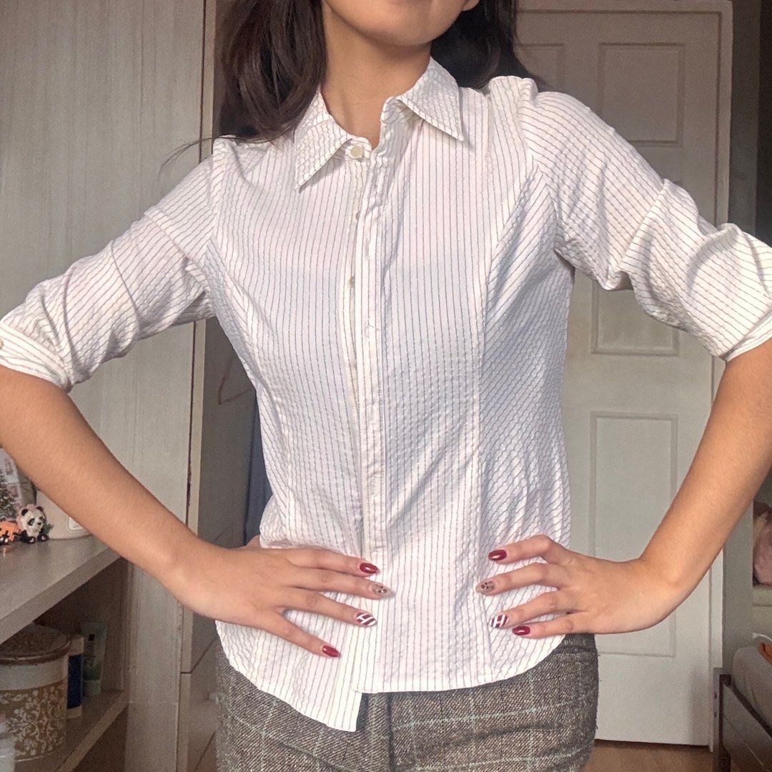 Striped Blouse - Size 34 (Category: Blouses) located in Quezon City. Submitted by kaeshops (Listing ID 1413364872, Image 2). Description: Decluttering my preloved clothes! PM me for more photos 🩷 items are negotiable if buying multiple items! Can do meet-ups or ship from Diliman, QC or Sampaloc, Manila - Wanko striped blouse! The thread used is some kind of sparkly ? Thread it’s so cute - Size 34 - Collared neckline - Button-down closure - Three