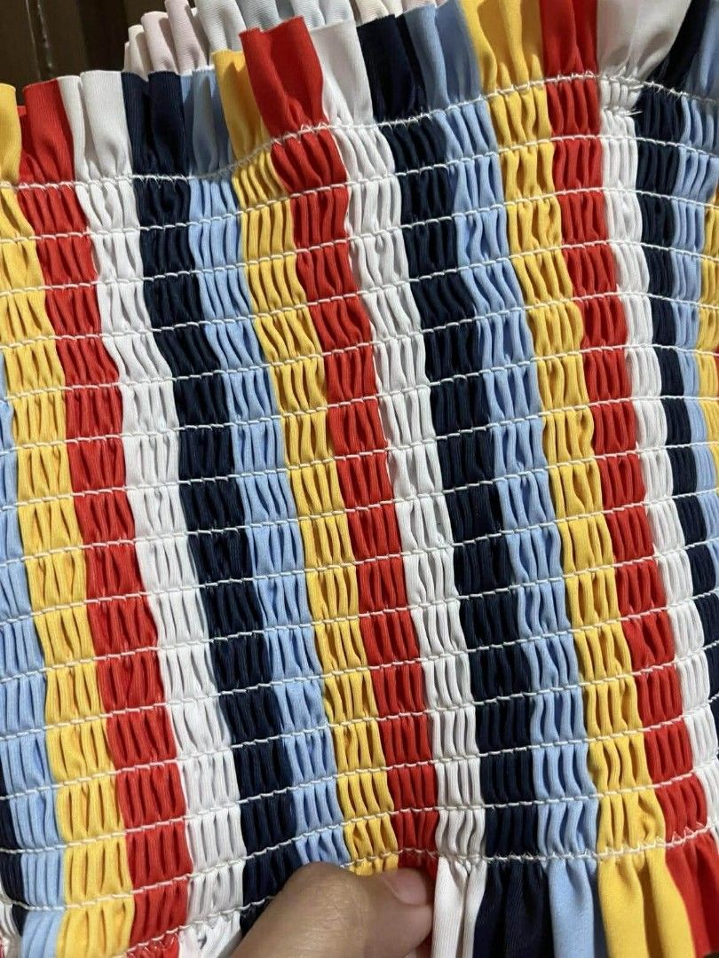 Striped Tube Crop Top (Category: Others Tops) located in Manila. Submitted by yhanies.corner (Listing ID 1413396005, Image 2). Description: - Striped tube top - Colors: Red, yellow, blue, and white - Adjustable red straps - Stretchy fabric - Comfortable fit - Perfect for summer or layering.