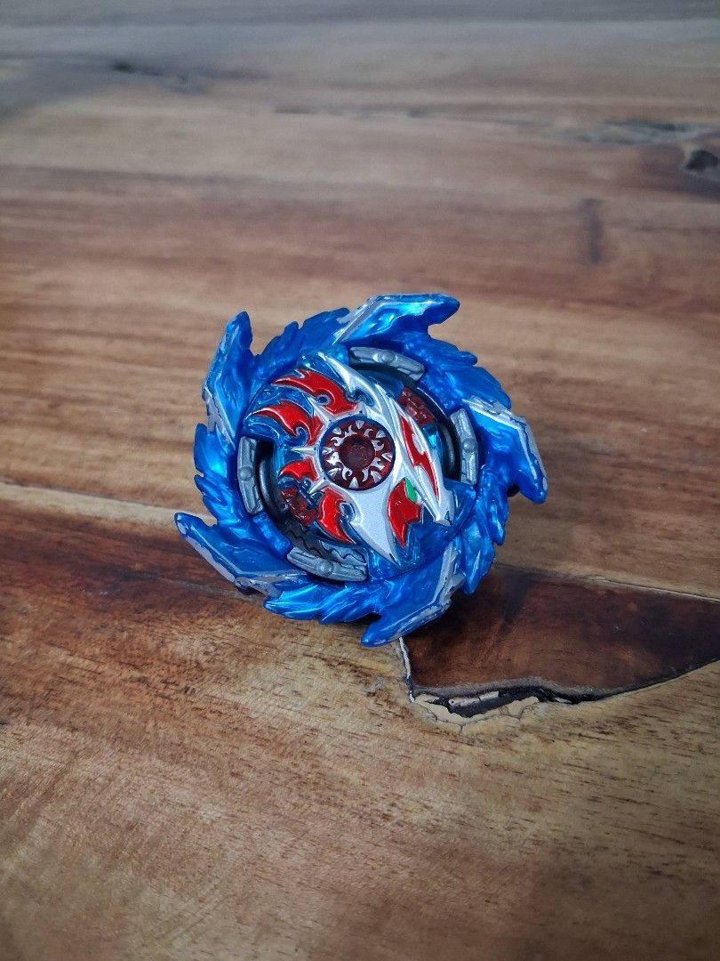 Takara Tomy Beyblade Burst B-160 King Helios Zone 1B (Category: Action & Battle Toys) located in Quezon City. Submitted by kaeroxas (Listing ID 1413360689, Image 1). Description: - Blue Beyblade Burst - Features blue and silver layer with red and white design - Includes layer, disc, and driver - Great for Beyblade collectors!.