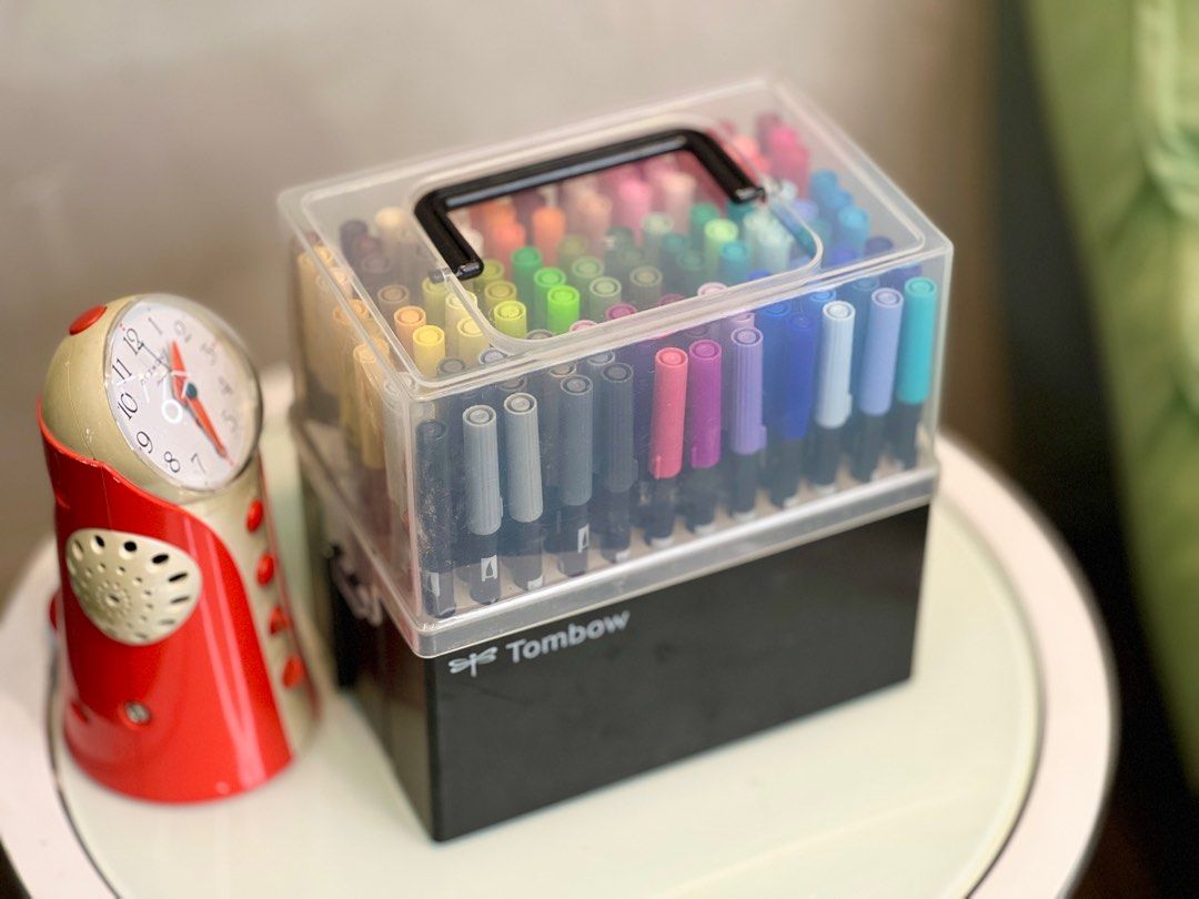 Tombow Dual Brush Pen Set (Category: Stationery & School Supplies) located in Bulacan. Submitted by rock_off.thriftshop.ph (Listing ID 1413384265, Image 1). Description: - Tombow Dual Brush Pen Set - Wide range of vibrant colors included - Perfect for lettering, drawing, and coloring - Comes in a black storage case with a clear lid - Ideal for artists and hobbyists.