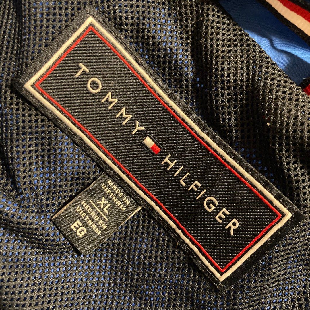 TOMMY HILFIGER BLUE WINDBREAKER JACKET (Category: Coats, Jackets and Outerwear) located in Taguig. Submitted by grindrr (Listing ID 1413425497, Image 3). Description: Hand me down from my grandparents from the US. Perfect for motorcycle rides through cold windy nights. RFS: Never need this. Masyadong vibrant ang color. Issues: Cracked ang mga printed portions of Hilfiger logos Didn't realize na cracked prints on clothes count as "defects". Everyt
