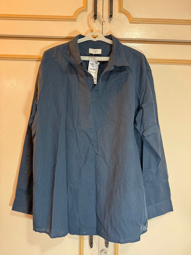 Topten 105 Long Sleeve Shirt (Category: Tshirts & Polo Shirts ) located in Manila. Submitted by hakunashop (Listing ID 1413316580, Image 2). Description: - Topten 105 long sleeve shirt - Color: Dark Blue - Features: Collared neckline, button-down - Fit: Relaxed - Fabric: Lightweight - Size: TL - Condition: Brand new with original price tag bought 38,800 won or P1,622 Last image for styling inspiration.