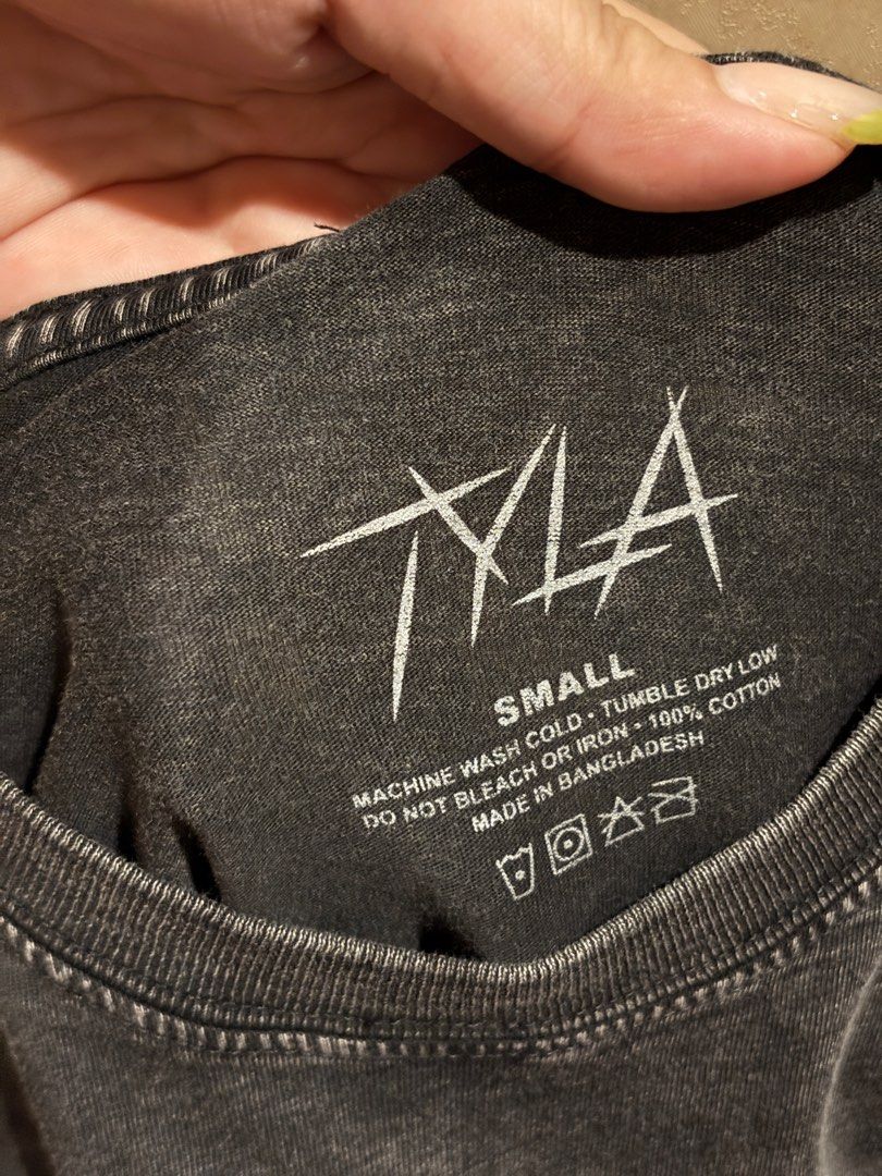 TYLA Asia’25 Graphic Tee - Small (Category: Tshirts & Polo Shirts ) located in Caloocan City. Submitted by steftaleon (Listing ID 1413367826, Image 2). Description: TYLA “We Wanna Party” tee in size small. Made of 100% cotton. Features a crew neck and short sleeves. Machine washable. (Just needs ironing!) Bought last Dec 3, 2025! OG Price: ₱2,200 RFS: Extra shirt, Bought the wrong size MOP: Gcash/Maya SF will be shouldered by the buyer!.