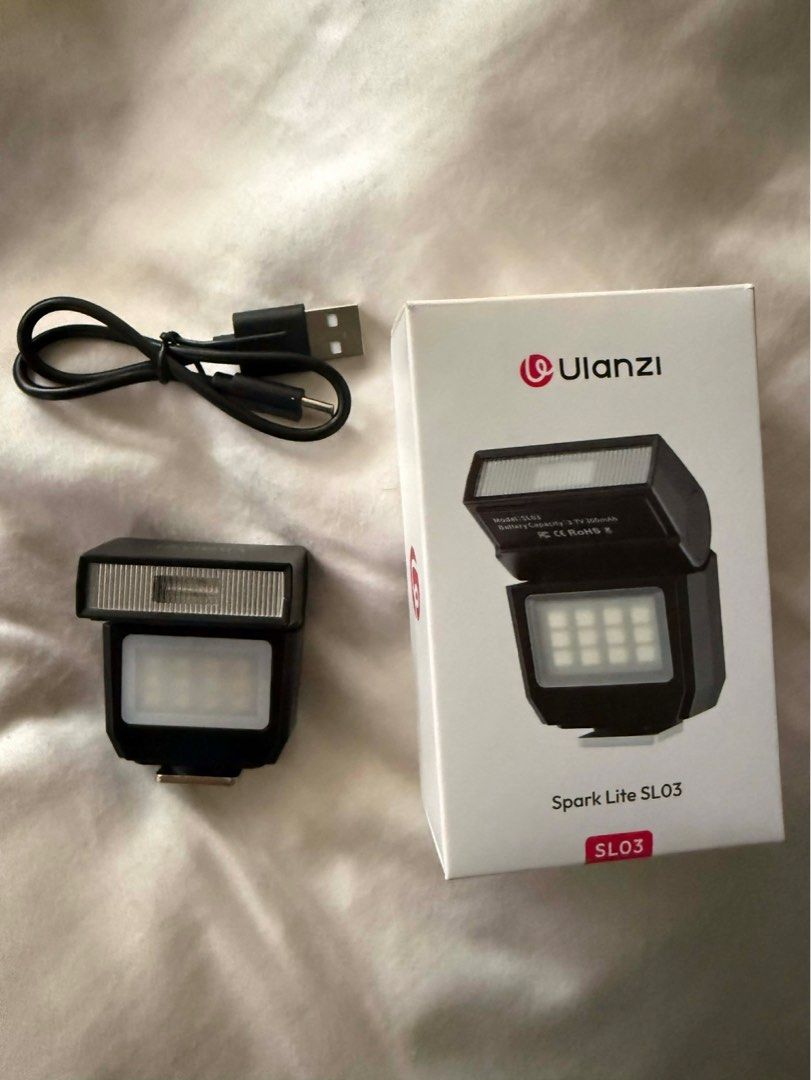 Ulanzi Spark Lite SL03 Flash (Category: Flashes) located in Manila. Submitted by swapog (Listing ID 1413237192, Image 2). Description: - Ulanzi Spark Lite SL03 flash - Includes: Flash unit, charging cable, original box - Built-in LED light - Designed for cameras - Model: SL03 - Battery: 3.7V 300mAh https://www.henryscameraphoto.com/Ulanzi-SL03-Spark-Lite-Camera-Flash?srsltid=AfmBOorO8F-nPZrYclMx27JOSDDR0nHeRNWhUiXsG50IaQP09dMeP82D.