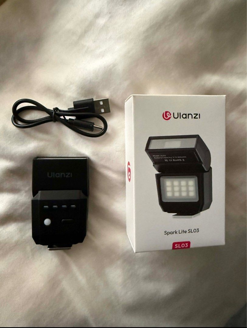 Ulanzi Spark Lite SL03 Flash (Category: Flashes) located in Manila. Submitted by swapog (Listing ID 1413237192, Image 1). Description: - Ulanzi Spark Lite SL03 flash - Includes: Flash unit, charging cable, original box - Built-in LED light - Designed for cameras - Model: SL03 - Battery: 3.7V 300mAh https://www.henryscameraphoto.com/Ulanzi-SL03-Spark-Lite-Camera-Flash?srsltid=AfmBOorO8F-nPZrYclMx27JOSDDR0nHeRNWhUiXsG50IaQP09dMeP82D.