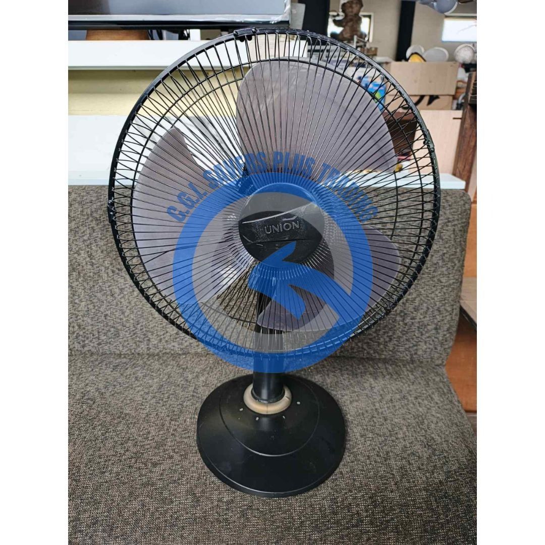 Union Desk Fan UGM-DF1623 (Category: Fans) located in San Pedro. Submitted by cgi.saversplustrading (Listing ID 1413286634, Image 3). Description: - Union desk fan, model UGM-DF1623 - Features a black base and fan guard - Blue and gray fan blades - Round base, sturdy design - Suitable for home or office - In good working condition.