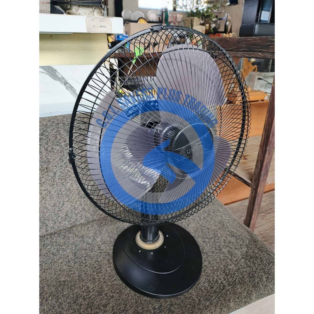 Union Desk Fan UGM-DF1623 (Category: Fans) located in San Pedro. Submitted by cgi.saversplustrading (Listing ID 1413286634, Image 2). Description: - Union desk fan, model UGM-DF1623 - Features a black base and fan guard - Blue and gray fan blades - Round base, sturdy design - Suitable for home or office - In good working condition.