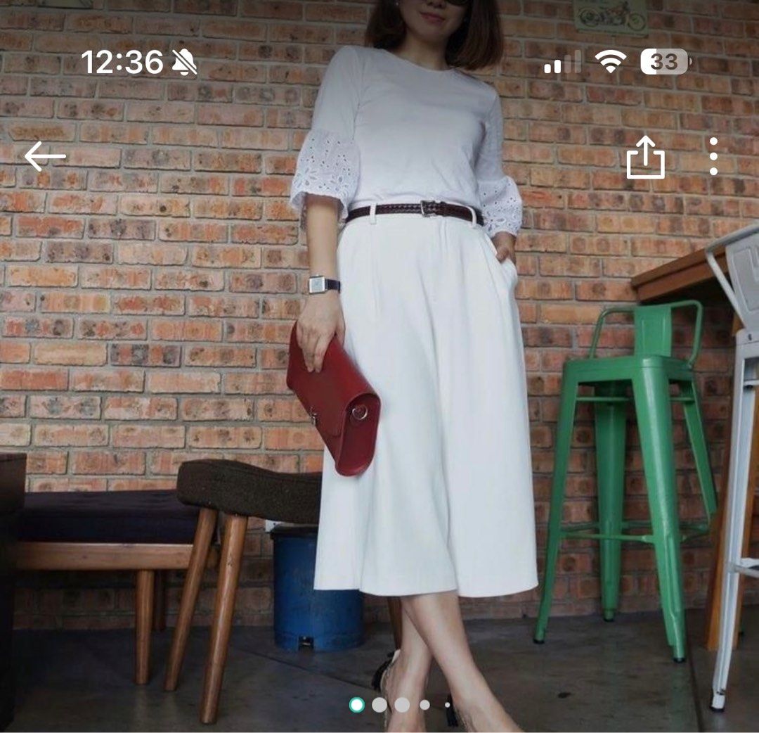Uniqlo White Culottes XS (Category: Other Bottoms) located in Quezon City. Submitted by WizeSpender (Listing ID 1413262701, Image 3). Description: - Uniqlo White Culottes - Size: XS - Waist: 24-25 inches / 60.5-63.5cm - Features: Wide-leg design - Material: Polyester and Spandex blend - Made in China.