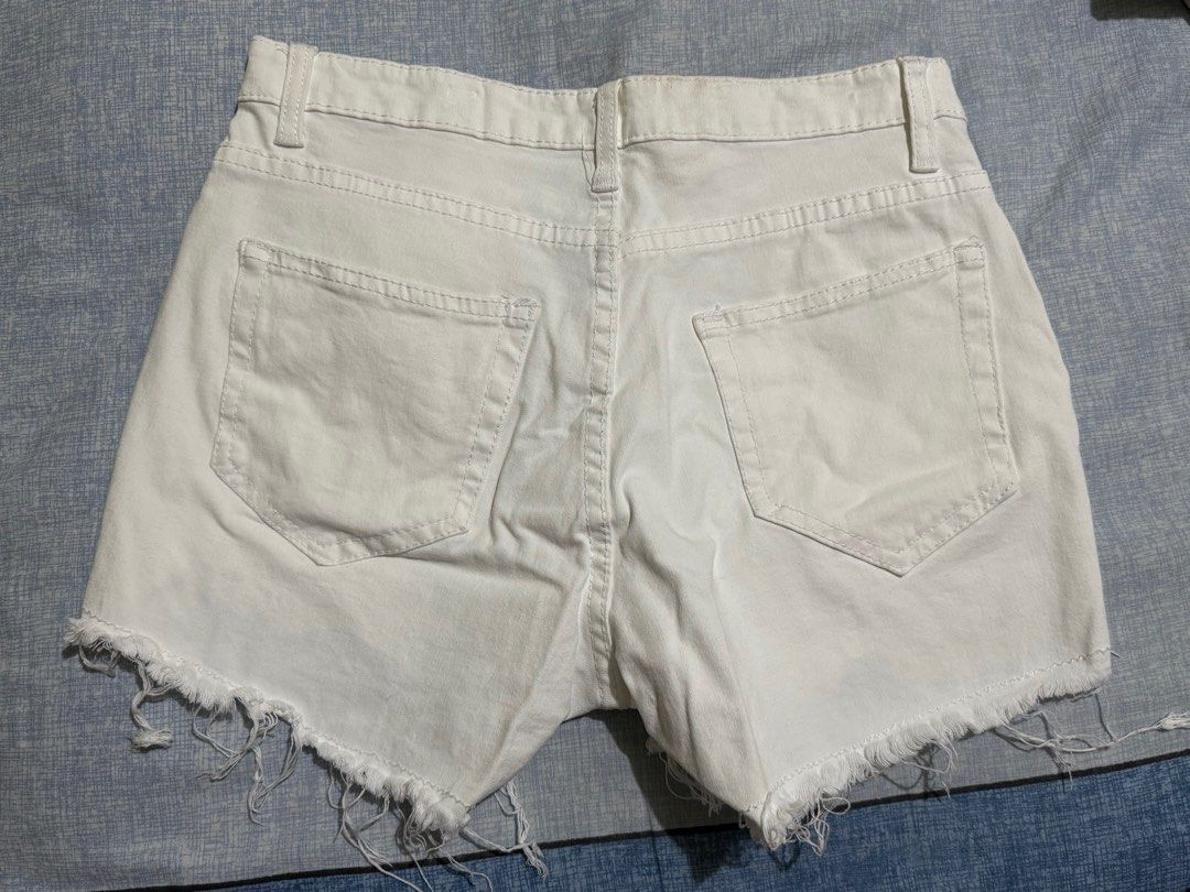 White Denim Shorts (Category: Shorts) located in Manila. Submitted by itswayne (Listing ID 1413311238, Image 2). Description: - Size 26 - High-waisted fit - Frayed hem detail - rfs: doesn’t fit me hehe - no issue - pockets are deep - material is slightly stretchable.