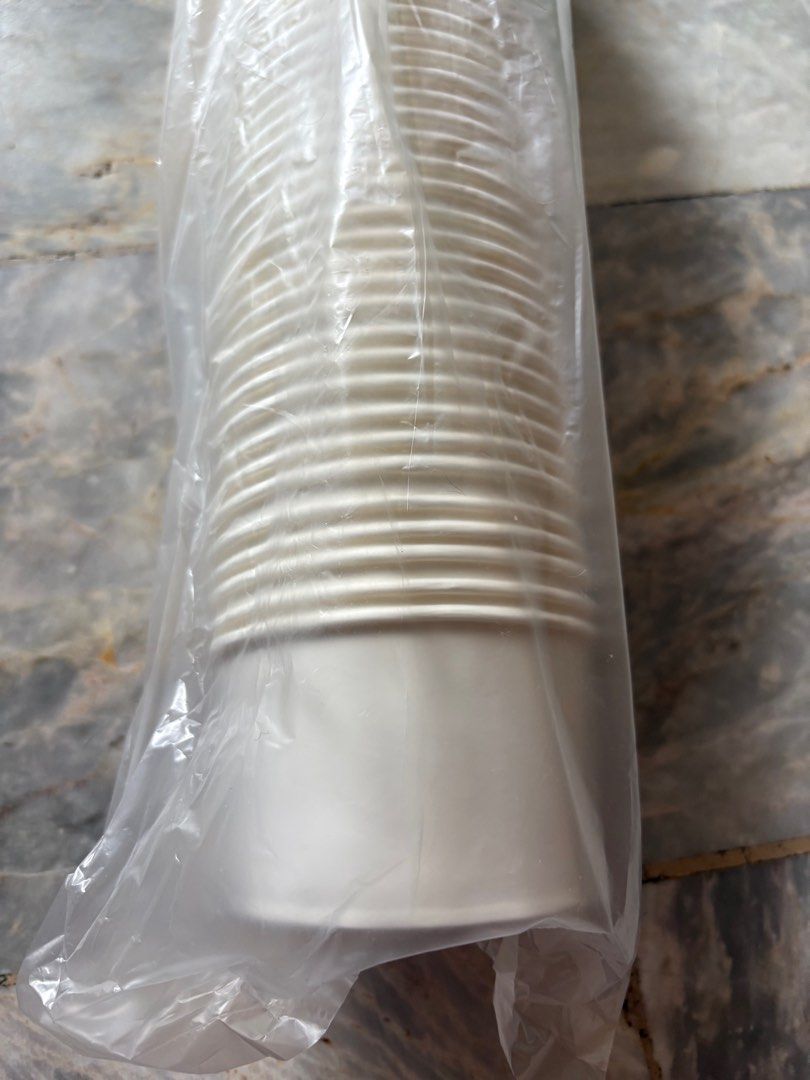 White Paper Cups (Category: Coffee & Tea Tableware) located in Rizal. Submitted by yang.1109 (Listing ID 1413244915, Image 2). Description: - White paper cups - Sealed in clear plastic bag - Unused condition - Suitable for hot and cold beverages - Ribbed design on upper portion - Smooth, tapered base - 200 ML.