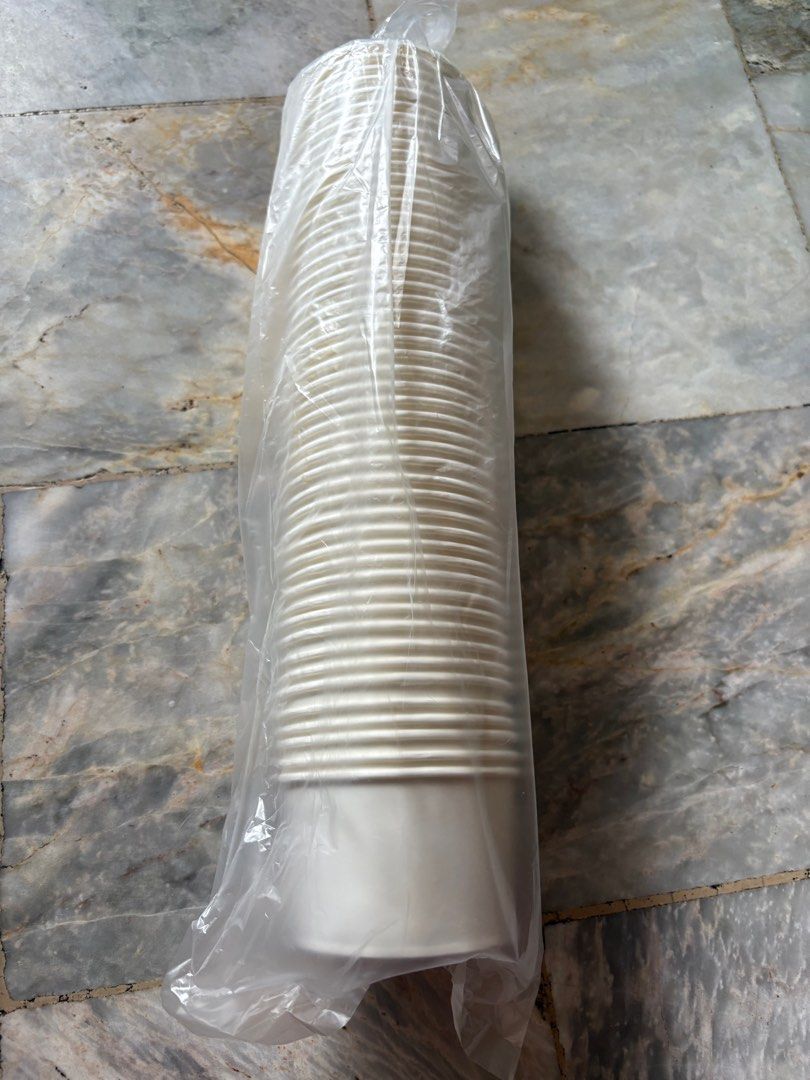 White Paper Cups (Category: Coffee & Tea Tableware) located in Rizal. Submitted by yang.1109 (Listing ID 1413244915, Image 1). Description: - White paper cups - Sealed in clear plastic bag - Unused condition - Suitable for hot and cold beverages - Ribbed design on upper portion - Smooth, tapered base - 200 ML.