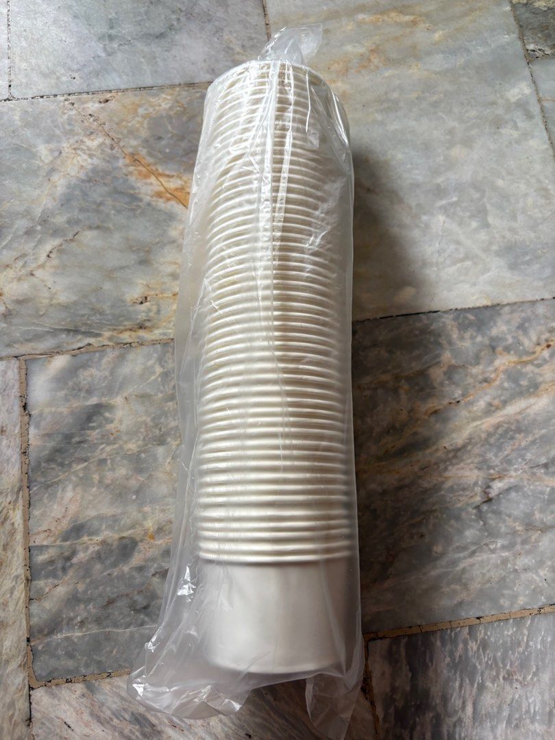 White Paper Cups (Category: Coffee & Tea Tableware) located in Rizal. Submitted by yang.1109 (Listing ID 1413244915, Image 3). Description: - White paper cups - Sealed in clear plastic bag - Unused condition - Suitable for hot and cold beverages - Ribbed design on upper portion - Smooth, tapered base - 200 ML.