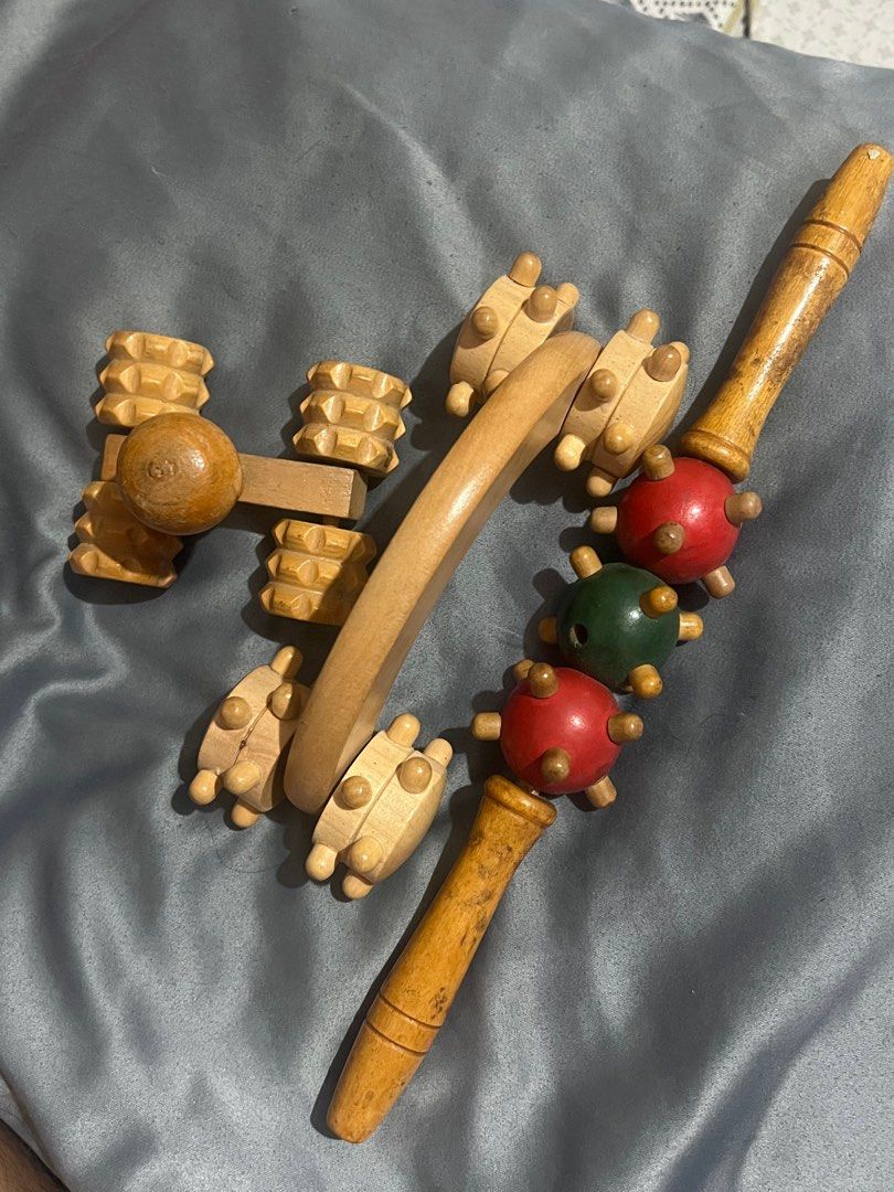 Wooden Body Massagers (Category: Massage Devices) located in Bustos. Submitted by dustfanshoppe (Listing ID 1413423120, Image 2). Description: - Two wooden body massagers included. - One with spiked balls for targeted massage. - One with rotating wooden rollers for a smooth massage. - Designed for muscle relaxation. - Suitable for self-massage or use on others. - Made of wood..