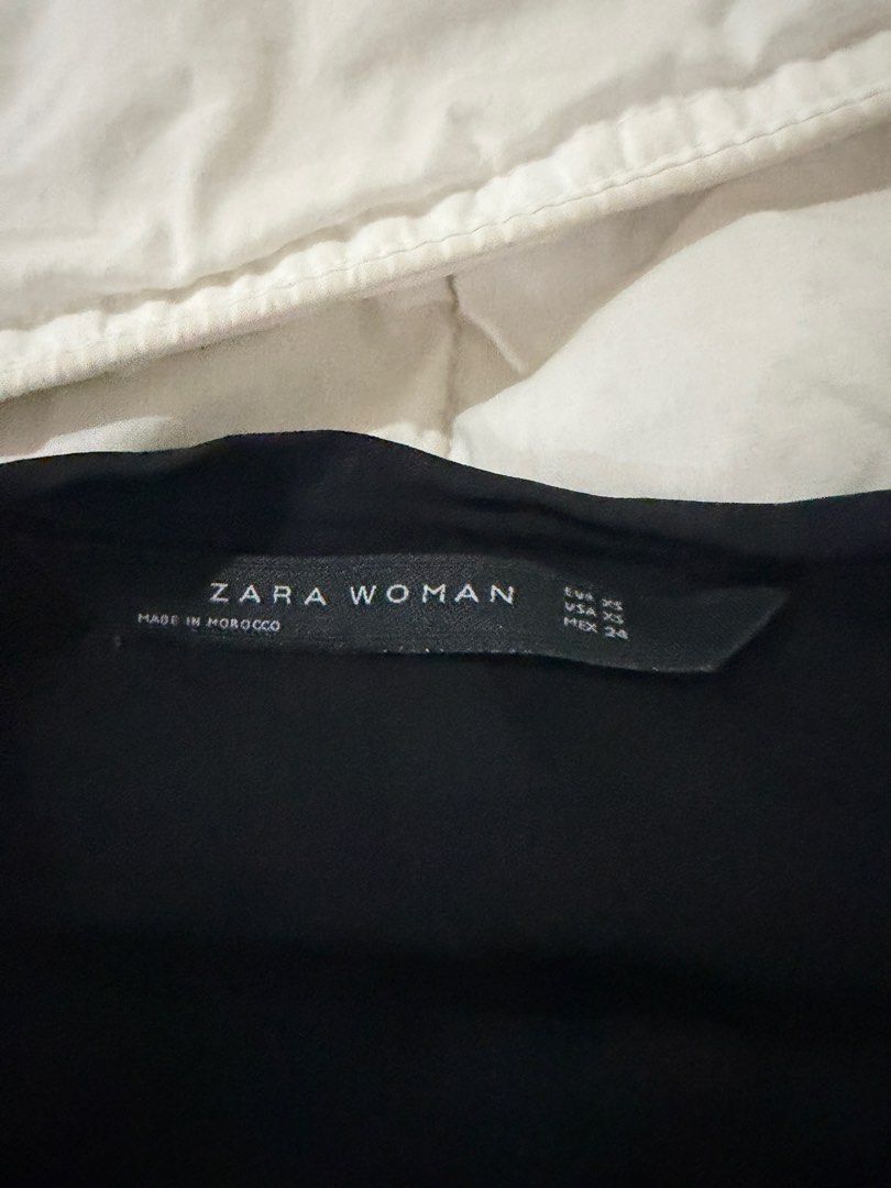Zara Woman Black Blouse (Category: Blouses) located in Makati City. Submitted by prelovedclothes18 (Listing ID 1413362901, Image 2). Description: - Zara Woman black blouse - Size: XS - Features: Long sleeves, ruffled neckline, tie front - Made in Morocco.