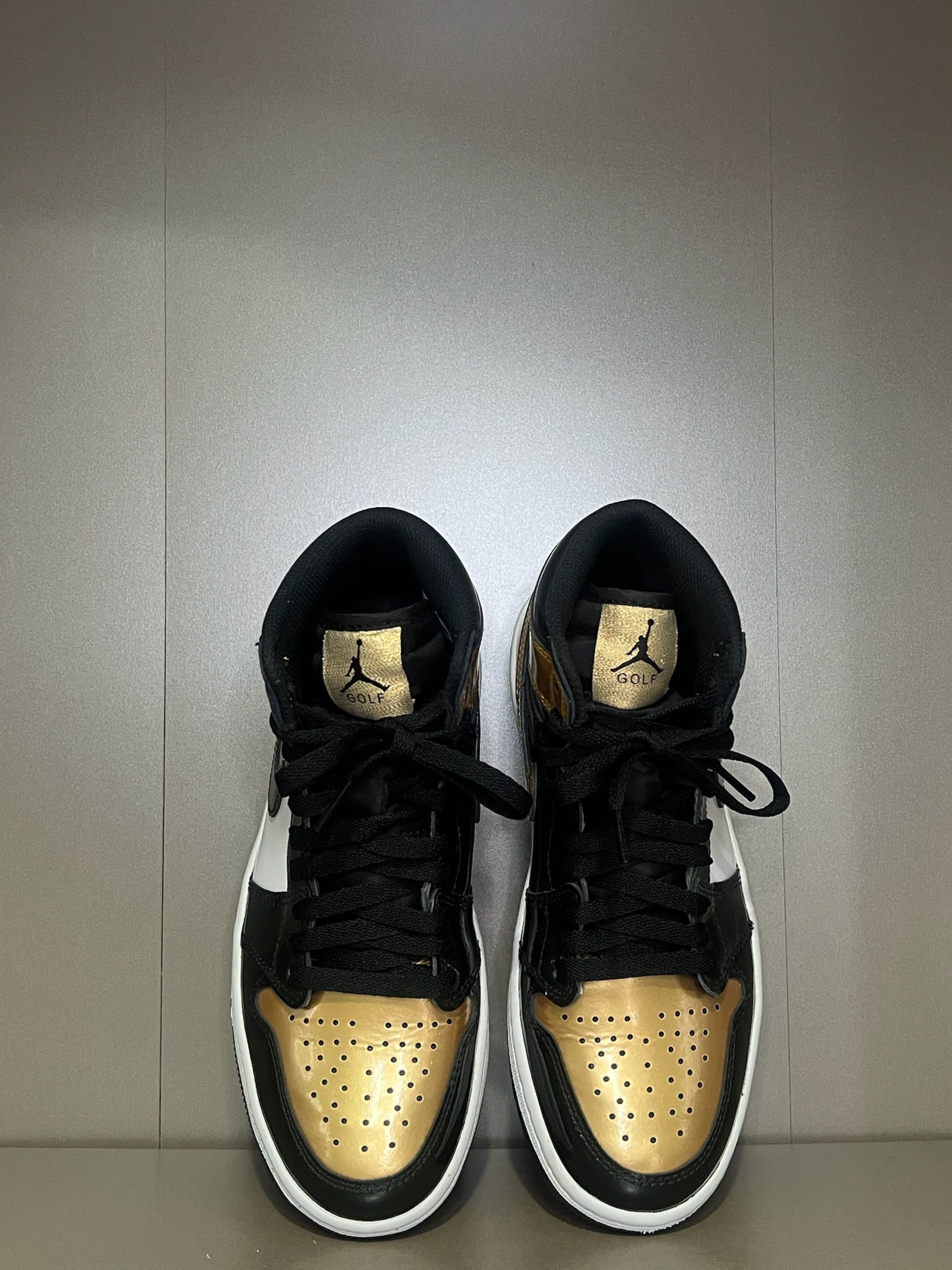 Air Jordan 1 Golf Black Gold (Category: Sneakers) located in Quezon City. Submitted by shoppaloco (Listing ID 1418598255, Image 2). Description: - Air Jordan 1 Golf shoes - Colorway: Black and Gold - White midsole - Black outsole - Black swoosh - Jordan logo on the side - "GOLF" logo on the tongue - Unworn condition.