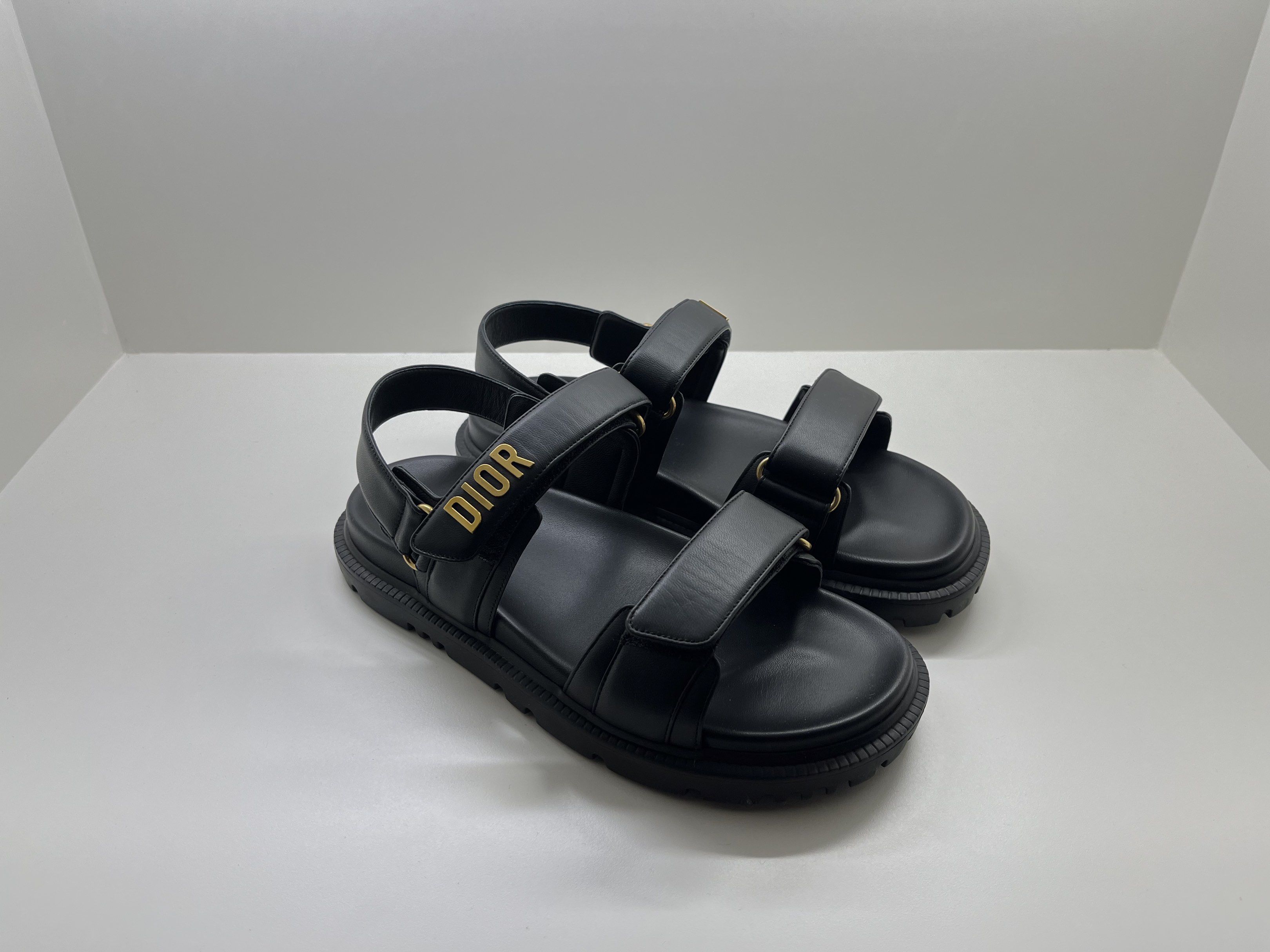 Authentic Dioract Black Sandals Lambskin - 38US (Category: Sneakers & Footwear) located in Bacolod City. Submitted by silvermannequin (Listing ID 1418775490, Image 2). Description: - Black Dior sandals - Adjustable straps - Gold Dior logo detail - Thick sole - Sleek and modern design - Suitable for various occasions 38US COMES COMPLETE WITH RECEIPT.